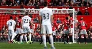Swansea City's Gylfi Sigurdsson (23) scores from a free-kick during the Premier League match at Old Trafford, Manchester. Swansea City's Gylfi Sigurdsson (23) scores from a free-kick during the Premier League match at Old Trafford, Manchester.