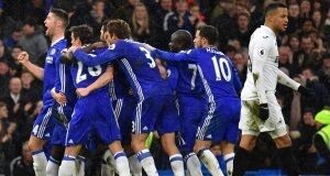 Chelsea's Pedro (hidden) celebrates scoring his side's second goal of the game with teammates during the Premier League match at Stamford Bridge, London. PRESS ASSOCIATION Photo.