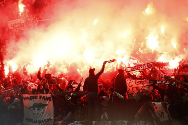 Flares in the stands at Old Trafford. Photo: Martin Rickett/PA Flares in the stands at Old Trafford. Photo: Martin Rickett/PA