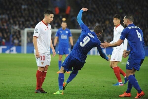 Leicester's Jamie Vardy falls after an incident with Sevilla's Samir Nasri, left, which resulted in a second yellow card for Nasri. Photo: AP Photo/Rui Vieira