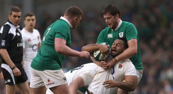 England's Billy Vunipola is tackled by Ireland's Iain Henderson at the Aviva Stadium. Photo: Brian Lawless/PA