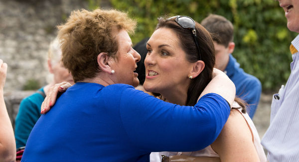 Olive Foley and Dolores Minihane share an embrace at the ceremony. Picture: Sean Curtin True Media