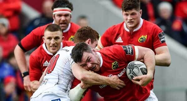 Peter O’Mahony of Munster is tackled by Paddy Jackson of Ulster at Thomond Park. Photo by Ramsey Cardy/Sportsfile