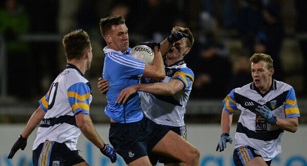 Ryan Deegan of Dublin in action against UCD's (from left) Seán Mullooly, Niall McInerney and Peter Healy at Parnell Park. Photo by Piaras Ó Mídheach/Sportsfile