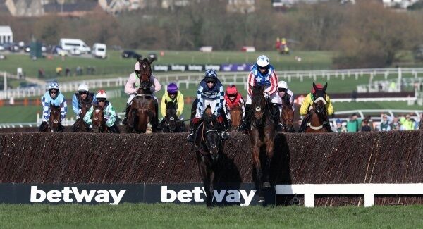 Special Tiara ridden by Noel Fehily (right) and God's Own ridden by Adrian Heskin (centre) lead the Betway Queen Mother Champion Chase. PRESS ASSOCIATION Photo