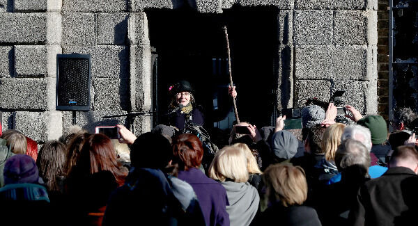 To mark the centenary of women getting the vote in Ireland, Micheline Sheehy the granddaughter of suffragette Hanna Sheehy Skeffington re-enacts her grandmother smashing the windows of Dublin Castle to highlight women's disenfranchisement. Pic: Niall Carson/PA Wire