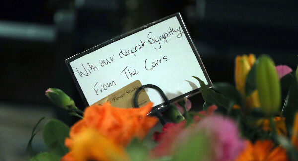 Floral tributes from the group The Corrs with the coffin of The Cranberries singer Dolores O'Riordan. Photo: Niall Carson/PA