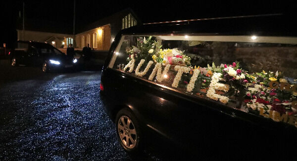 Floral tributes in the hearse as the coffin of The Cranberries singer Dolores O'Riordan is taken into St Ailbe's Church, Ballybricken. Photo: Niall Carson/PA