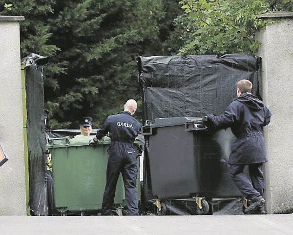 Wheeled bins are delivered to the scene as searches continue in Chapelizod, Dublin. Picture: PA