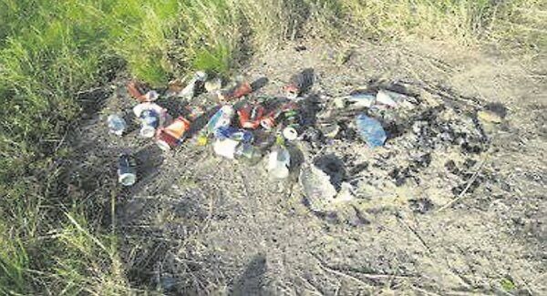 Some of the scorch marks and rubbish left by campfires which were lit over the weekend in the sensitive dunes area of Ardnahinch Beach.