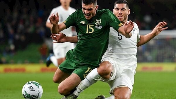 Troy Parrott in action against Michael Boxall of New Zealand. Photo by Seb Daly/Sportsfile
