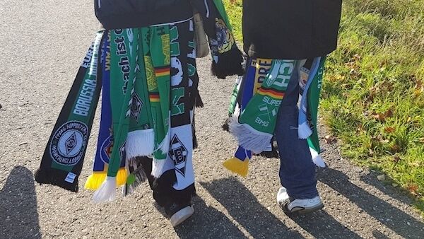 Gladbach sell a variety of scarves, with some fans sporting their own, as well as former opponents’, colours. Gladbach sell a variety of scarves, with some fans sporting their own, as well as former opponents’, colours.