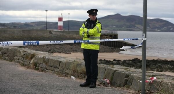 File photo of a Garda at the pier last year after the accident. File photo of a Garda at the pier last year after the accident.