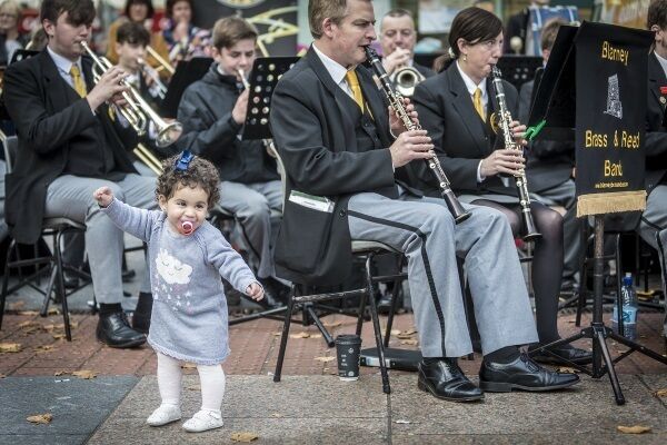 Young Leyla Sayed Ahmed from Egypt enjoys the music played by the Blarney Brass and Reed Band during Saturday’s Jazz event in Cork City. Picture: Andy Jay