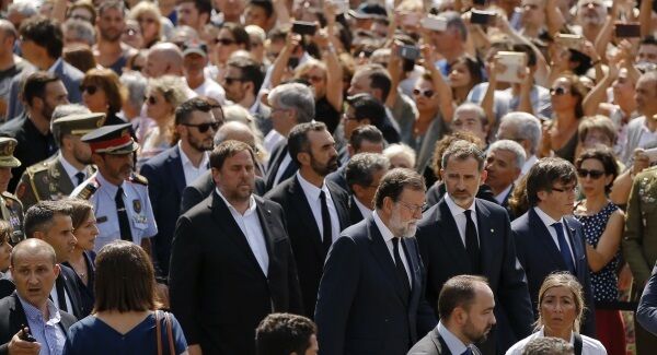 King Felipe of Spain, second from right, and Prime Minister Mariano Rajoy, third from right, arrive for a minute of silence in memory of the terrorist attacks victims in Las Ramblas, Barcelona.