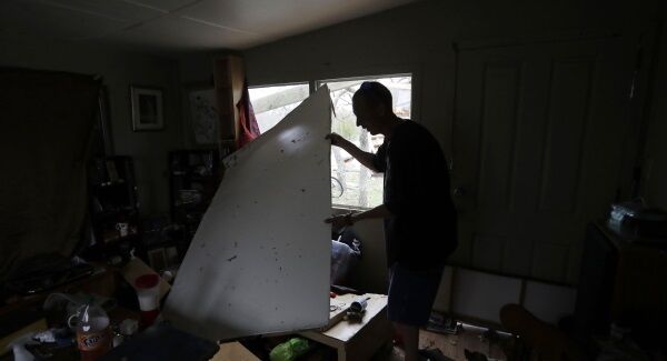Sam Speights moves around debris as he checks on the damage to his home in the wake of Hurricane Harvey, yesterday. Sam Speights moves around debris as he checks on the damage to his home in the wake of Hurricane Harvey, yesterday.