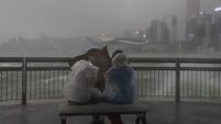 Hong Kong shuts down as powerful typhoon sweeps past; at least 3 killed