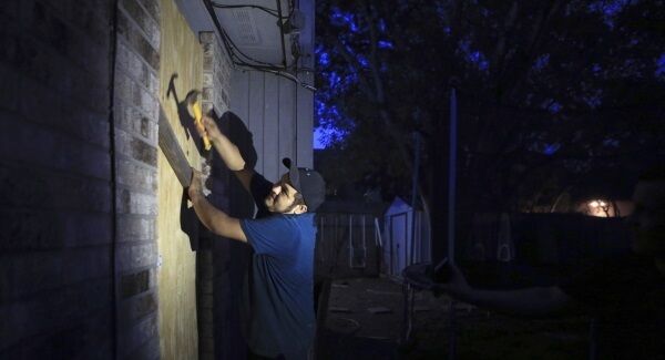 Mauro Eligio boards up his home on the Southside of Corpus Christi, Texas. Mauro Eligio boards up his home on the Southside of Corpus Christi, Texas.