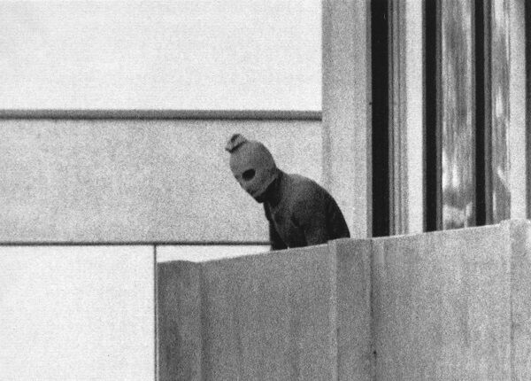 In this Sept. 5, 1972 b/w file photo, a member of the Arab Commando group which seized members of the Israeli Olympic Team at their quarters at the Munich Olympic Village appears with a hood over his face on the balcony of the village building where the commandos held members of the Israeli team hostage. In this Sept. 5, 1972 b/w file photo, a member of the Arab Commando group which seized members of the Israeli Olympic Team at their quarters at the Munich Olympic Village appears with a hood over his face on the balcony of the village building where the commandos held members of the Israeli team hostage.