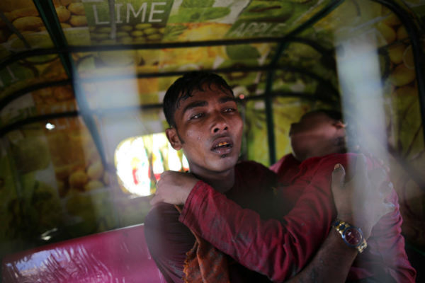 Rohingya Muslims, who crossed over from Burma into Bangladesh, are seen on the shore of Bay of Bangal after the boat she was traveling in capsized at Shah Porir Dwip, Bangladesh. Photo by Zakir Hossain Chowdhury/Anadolu Agency/Getty Images Rohingya Muslims, who crossed over from Burma into Bangladesh, are seen on the shore of Bay of Bangal after the boat she was traveling in capsized at Shah Porir Dwip, Bangladesh. Photo by Zakir Hossain Chowdhury/Anadolu Agency/Getty Images