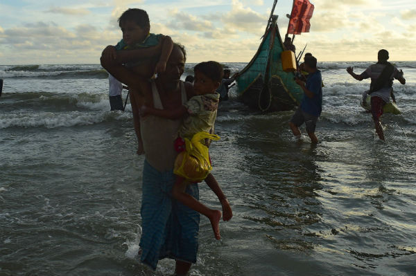 Rohingya refugees disembark from a boat after crossing the border from Burma, on the Bangladeshi shores of the Naf river in Teknaf. Photo: MUNIR UZ ZAMAN/AFP/Getty Images Rohingya refugees disembark from a boat after crossing the border from Burma, on the Bangladeshi shores of the Naf river in Teknaf. Photo: MUNIR UZ ZAMAN/AFP/Getty Images