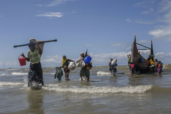 Rohingya Muslims walk to shore after arriving on a boat from Burma to Bangladesh in Shah Porir Dwip, Bangladesh. AP Photo/Dar Yasin Rohingya Muslims walk to shore after arriving on a boat from Burma to Bangladesh in Shah Porir Dwip, Bangladesh. AP Photo/Dar Yasin