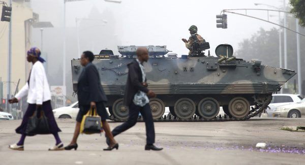 An armed soldier patrols a street in Harare, Zimbabwe An armed soldier patrols a street in Harare, Zimbabwe