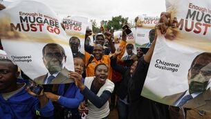 Crowds gather in Harare to march against beleaguered Robert Mugabe