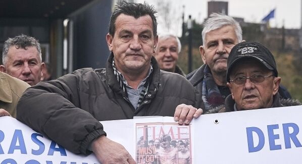 Alic, a Bosnian man who became a figurehead for the suffering of Bosnians during the war when he was photographed as an emaciated prisoner behind the wire of a Bosnian Serb prison camp, was among those waiting to watch the hearing. Pic: AP Photo/Phil Nijhuis Alic, a Bosnian man who became a figurehead for the suffering of Bosnians during the war when he was photographed as an emaciated prisoner behind the wire of a Bosnian Serb prison camp, was among those waiting to watch the hearing. Pic: AP Photo/Phil Nijhuis