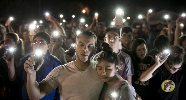 Matthew Mata and Erika Gonzalez participate in a memorial service for the victims of Sunday&rsquo;s church shooting in Sutherland Springs