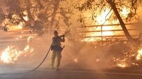 California wildfires force thousands to flee homes