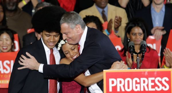 Bill DeBlasio, pictured with his children at his election win in 2013, has been elected for a second term as Mayor of New York
