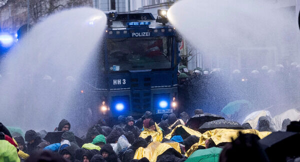 Police use a water cannon to clear a street that is blocked by demonstrators near the congress center where the party convention of the Alternative for Germany, AfD, is held in Hannover. Pic: Peter Steffen/dpa via AP Police use a water cannon to clear a street that is blocked by demonstrators near the congress center where the party convention of the Alternative for Germany, AfD, is held in Hannover. Pic: Peter Steffen/dpa via AP