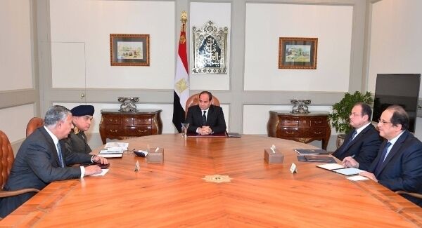 Egypt's Presidency shows Abdel-Fattah El-Sissi, center, meeting with officials in Cairo after militants attacked a crowded mosque during Friday prayers in the Sinai Peninsula.(Egyptian Presidency via AP)