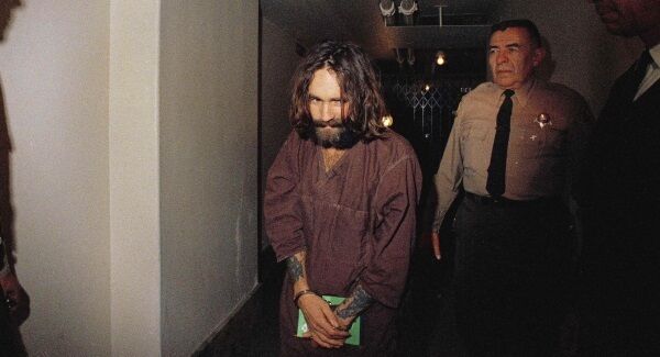 Charles Manson is escorted to court in Los Angeles during an arraignment phase.