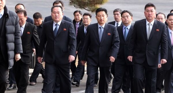 The head of North Korean delegation Ri Son Gwon, second from left, arrives at the South side for the meeting with South Korea at the Panmunjom in the Demilitarized Zone in Paju, South Korea. The head of North Korean delegation Ri Son Gwon, second from left, arrives at the South side for the meeting with South Korea at the Panmunjom in the Demilitarized Zone in Paju, South Korea.