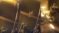 Heartstopping video shows firefighter catch child thrown from third floor blaze
