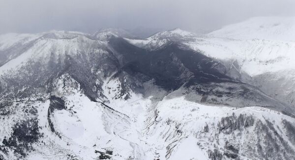 Ashes from Mount Kusatsu-Shirane cover near its summit after its eruption in Kusatsu, Gunma prefecture, central Japan.
