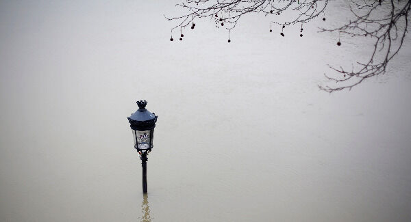 A flooded street lamp. AP Photo//Thibault Camus