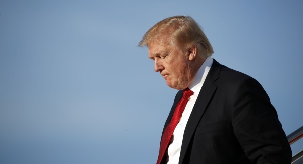Trump criticises woman over 'forced kiss' claims