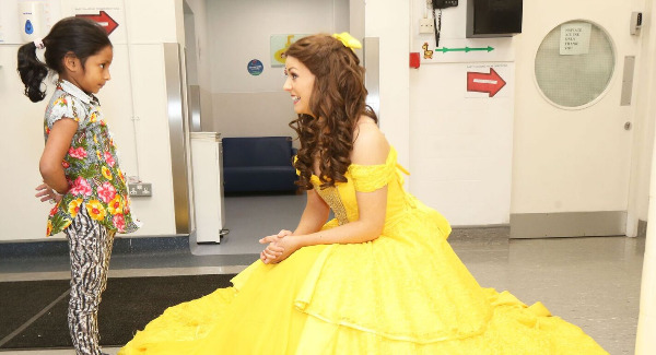 Children in Temple Street delighted with visit from Belle, Beast, and panto cast
