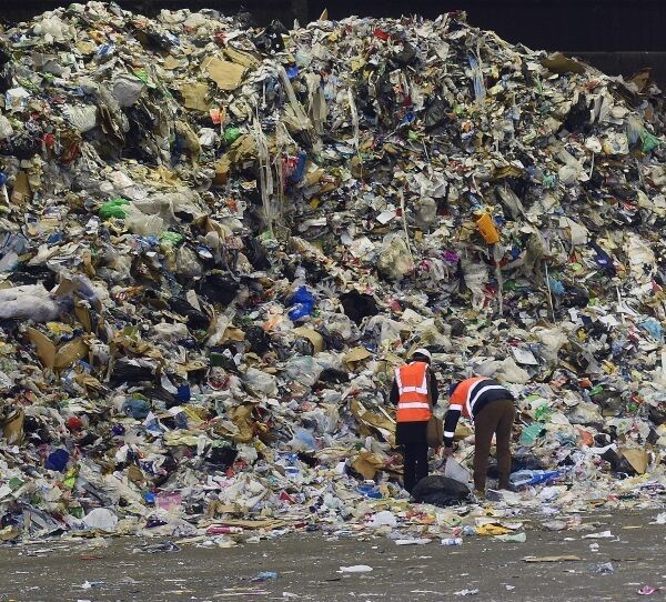 Visitors to the Panda Irish Packaging Recycling plant are dwarfed by an enormous mound of material collected from Dublin households. Picture: Moya Nolan