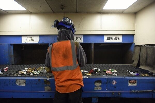 A Panda Irish Packaging Recycling worker seperates waste materialat the facility in Dublin.Picture: Moya Nolan