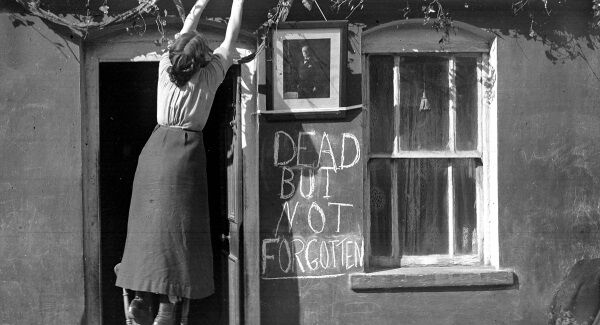 ‘Dead But Not Forgotten’: A tribute is placed to John Redmond MP, most likely in Waterford, during the byelection that followed the death of the Irish Parliamentary Party leader in March 1918. Picture: Irish Examiner photographic archive