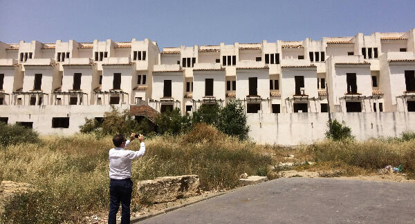 Martin de La Herran takes a photograph of another unfinished off-plan development in Manilva, where many Irish victims lost deposits.