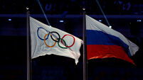 Russia and Olympic Flags File Photo