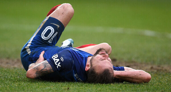 Danny Lloyd lies injured after colliding with a goal post. Pic: Joe Giddens/PA Wire