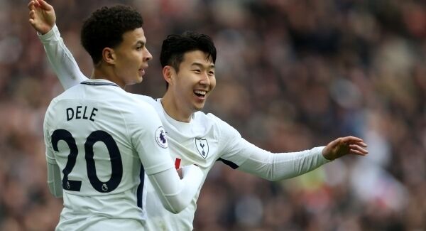 Tottenham Hotspur&rsquo;s Son Heung-Min (right) celebrates scoring his side&rsquo;s fourth goal with Dele Alli. Pic: Steven Paston/PA Wire
