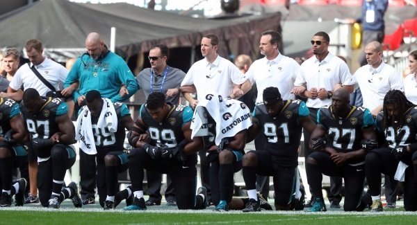 NFL talks bring no immediate resolution over standing for the American anthem