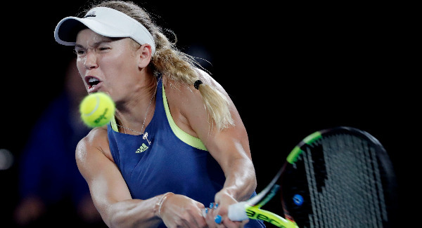 Caroline Wozniacki progresses after late finish at Australian Open